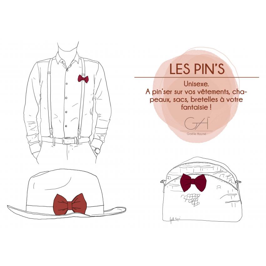 Pin's noeud imprimé floral bleu, terracotta centré doré